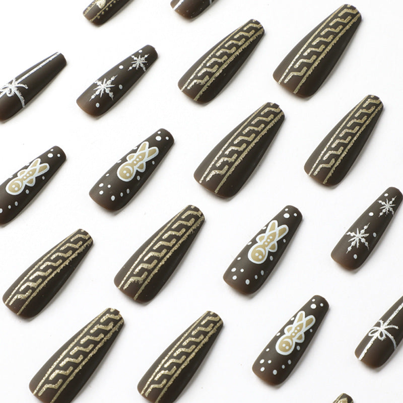 Artificial nail art with festive gingerbread design Kalsten