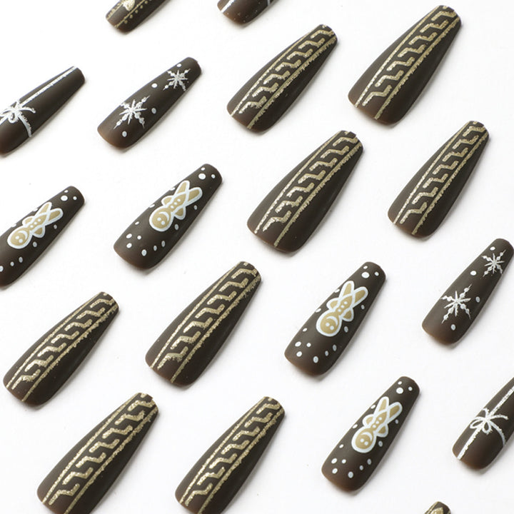 Artificial nail art with festive gingerbread design Kalsten