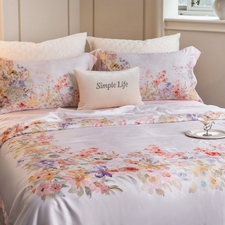Luxurious cotton satin bed linen set with delicate floral print and quilted bedspread