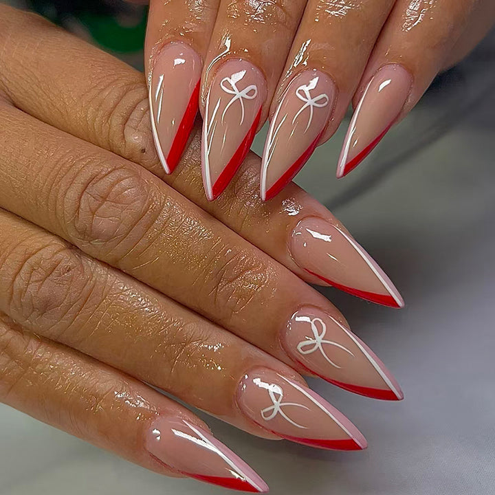 Artificial nails in elegant stiletto design with bow accents Kalsten