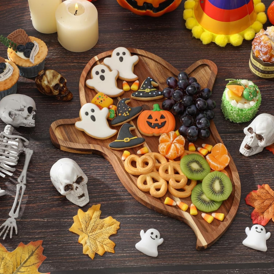 Skull-engraved acacia wood serving board with a raised edge