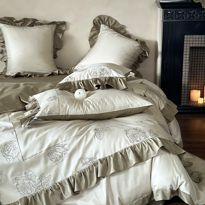 Ruffled bedding set made of cotton satin with rose embroidery and contrast piping
