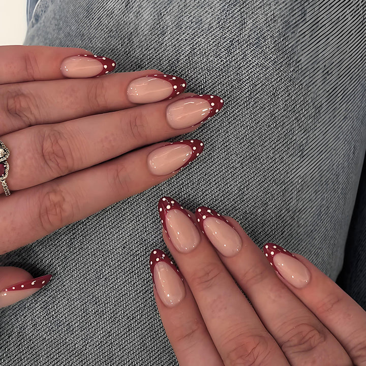 Nail art set with elegant red tips and playful dots Kalsten