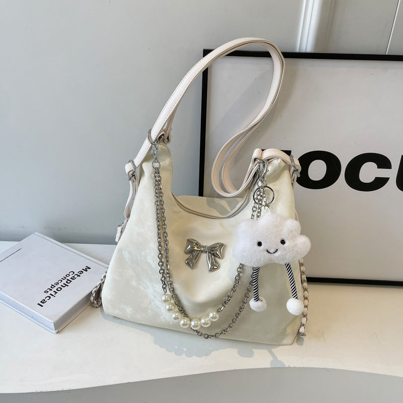 Fashionable handbag with unique pendant and chain accents Kalsten