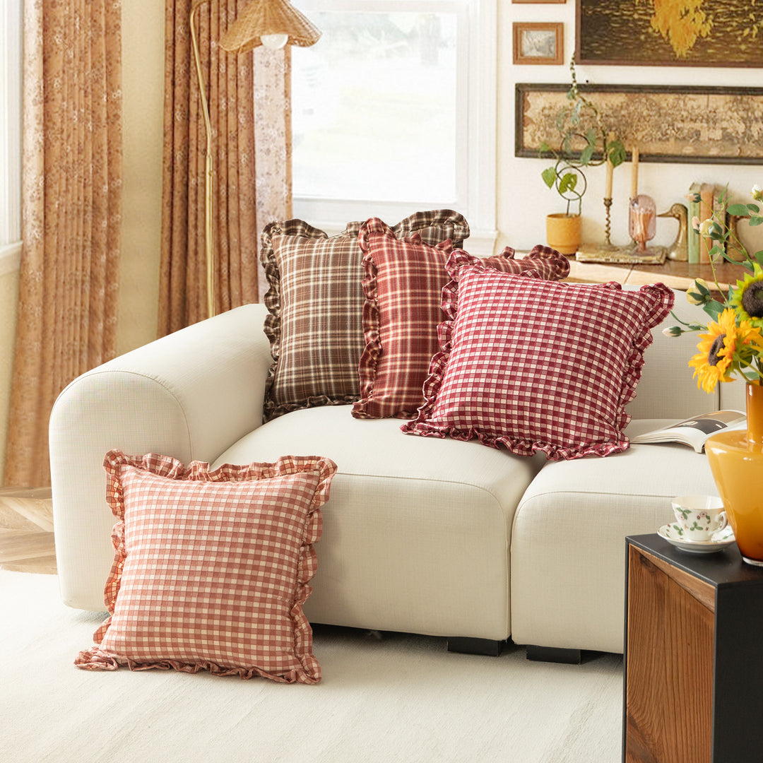 Decorative cushion with gingham pattern and playful ruffled edge