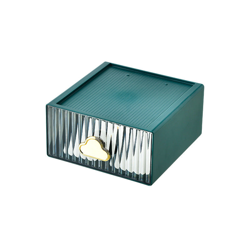 Small jewelry storage box with ribbed front and decorative cloud handle