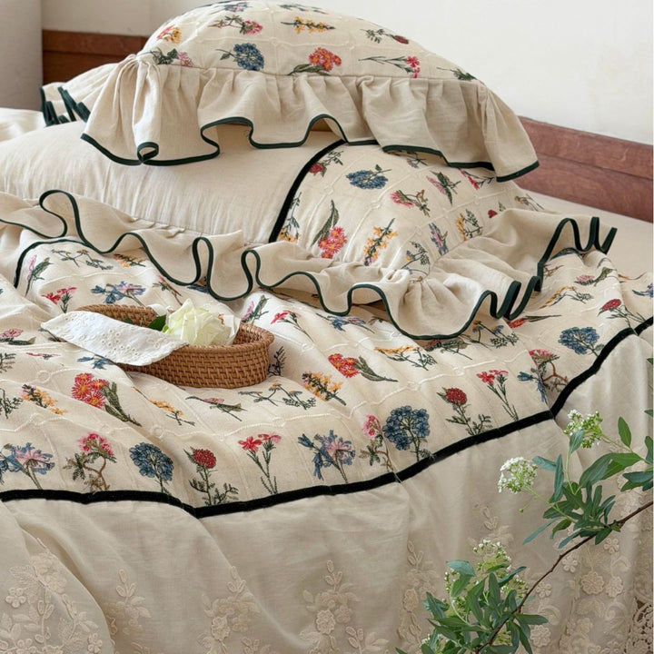 luxurious quilted bedspread set with embroidered lace and flounces