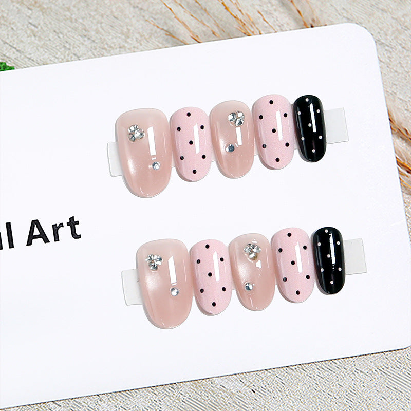 Acrylic nail set with glamorous rhinestone accents and modern dots Kalsten