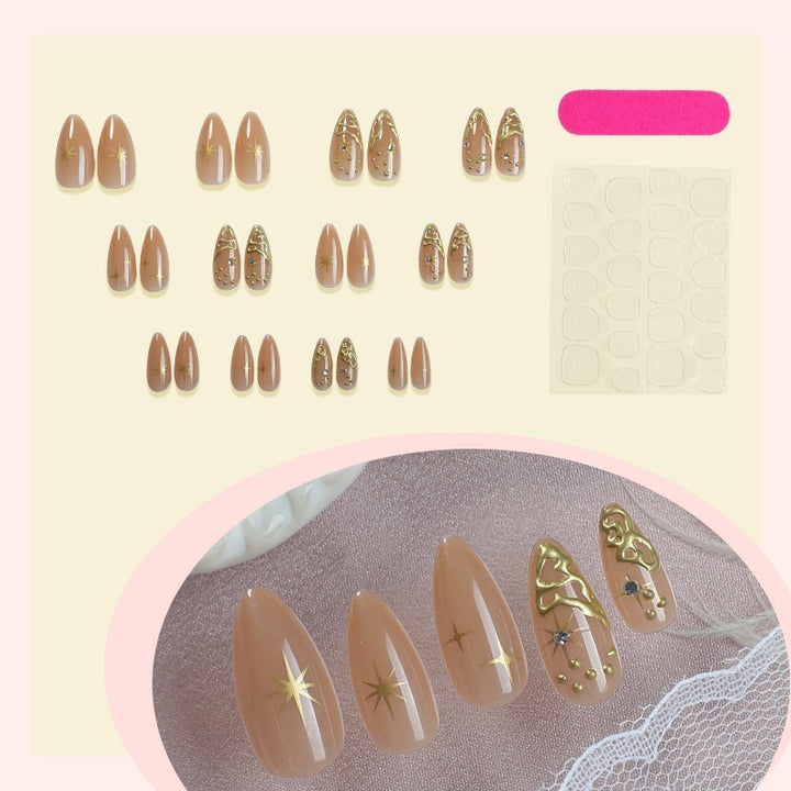 Creative nail set with elegant gold embellishments and sparkling accents Kalsten