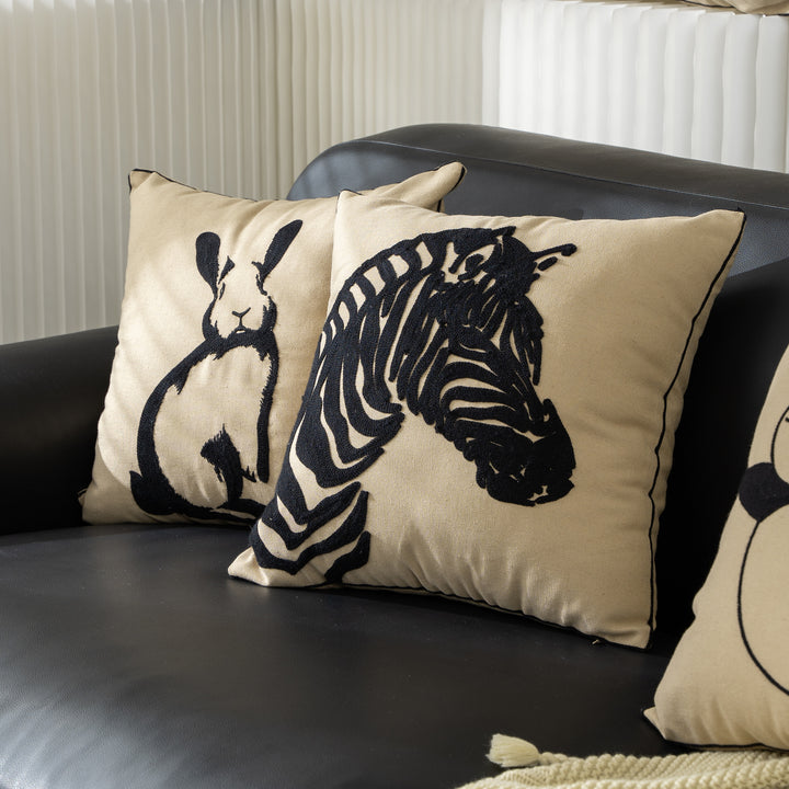 Cotton decorative pillow with raised dog tuft embroidery and contrasting piping