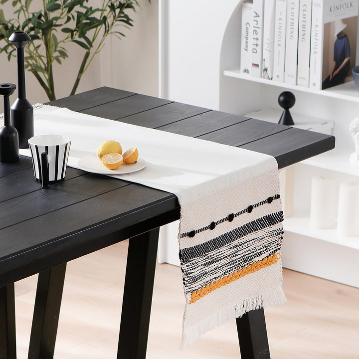 Woven cotton table runner with boho stripes, fringes, and textured woven edge Kalsten