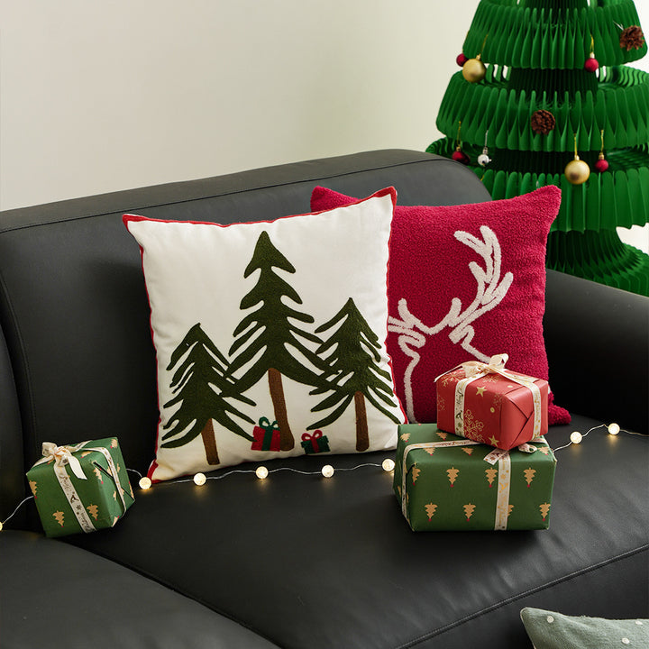 Hand-stitched winter decorative sofa cushion with sled and fir motif