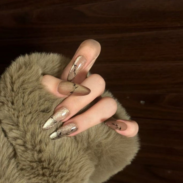 Artistic Press-On Nail Design with Floral and Glitter Accents Kalsten