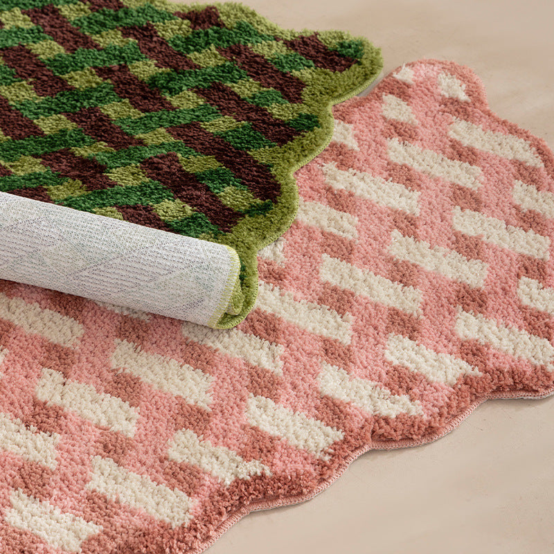 Tufted bathroom mat with wavy edge and geometric relief
