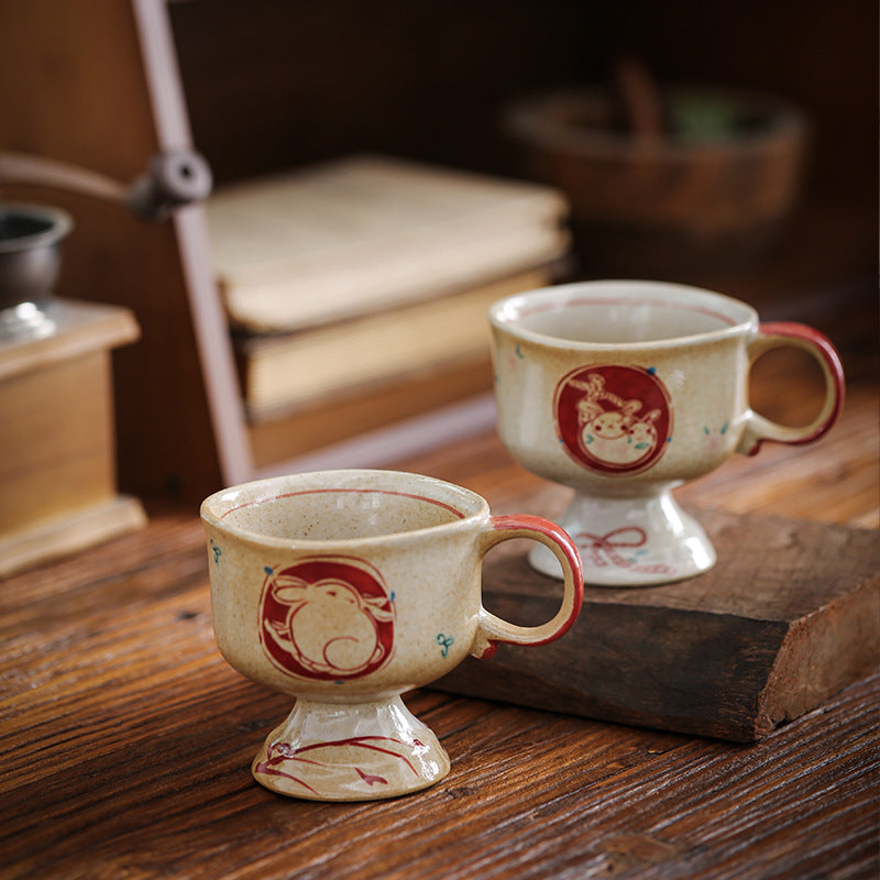 Ceramic foot mug with handle and hand-painted rabbit illustration