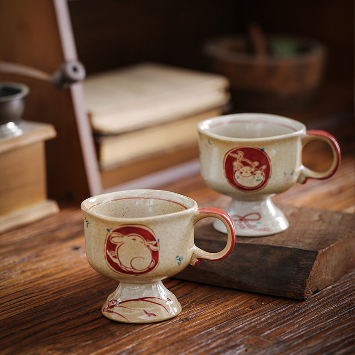 Ceramic foot mug with handle and hand-painted rabbit illustration