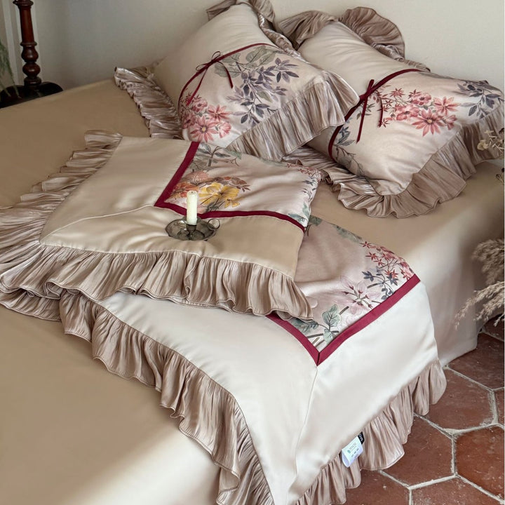 Romantic satin bedding set with ruffles, floral embroidery and reversible function