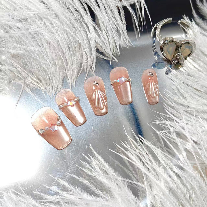 Elegant artificial nails with pearl and rhinestone embellishments Kalsten
