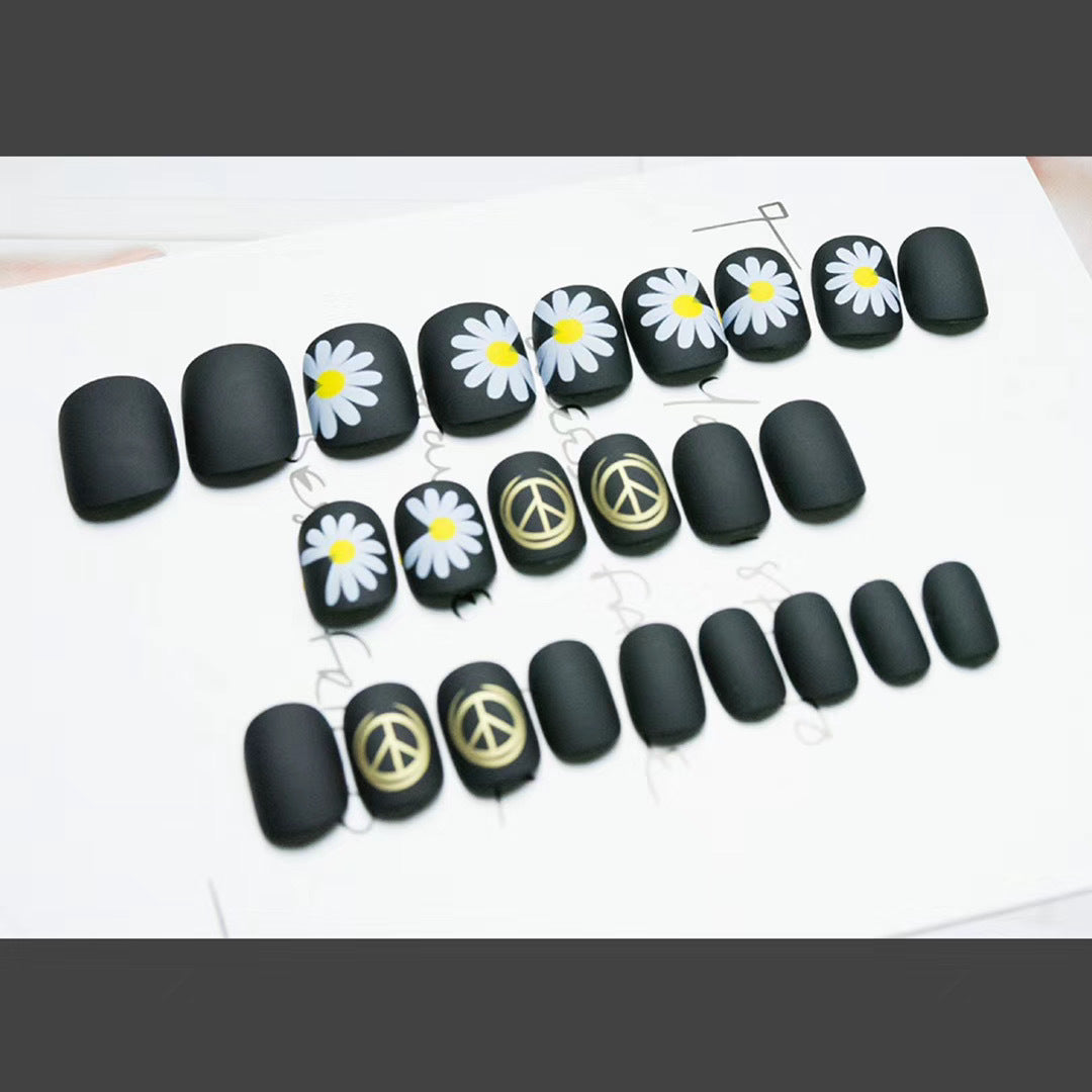 Artistic Press-On Nail Design with Floral and Geometric Accents