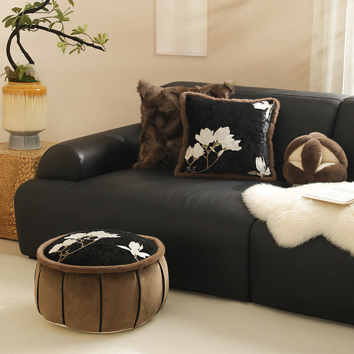 Square velvet decorative cushion with embroidered magnolia motif and faux fur border