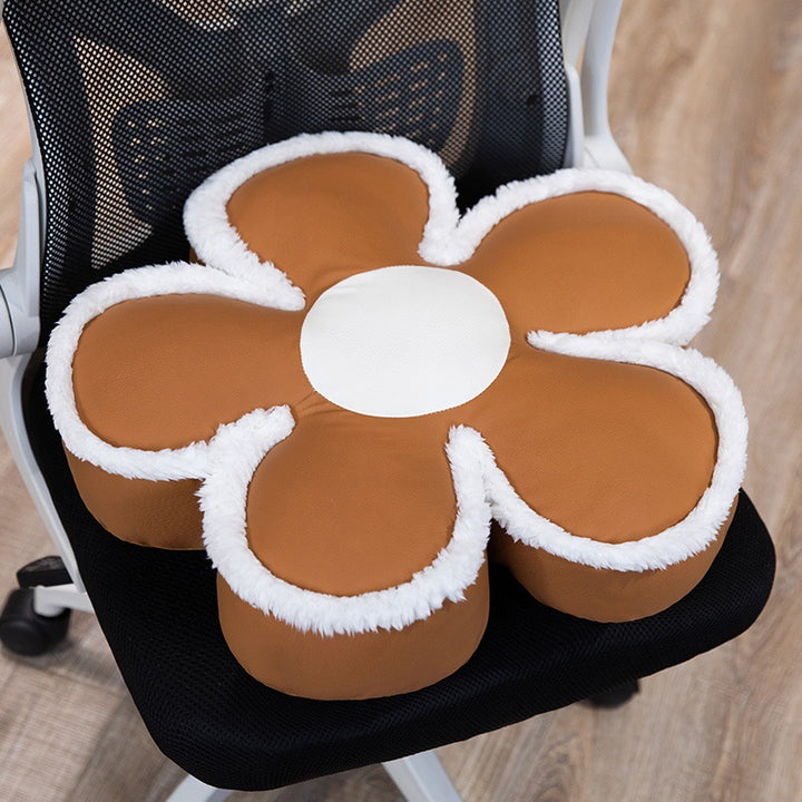 Padded seat cushion in flower shape with faux leather center piece and fluffy edge padding