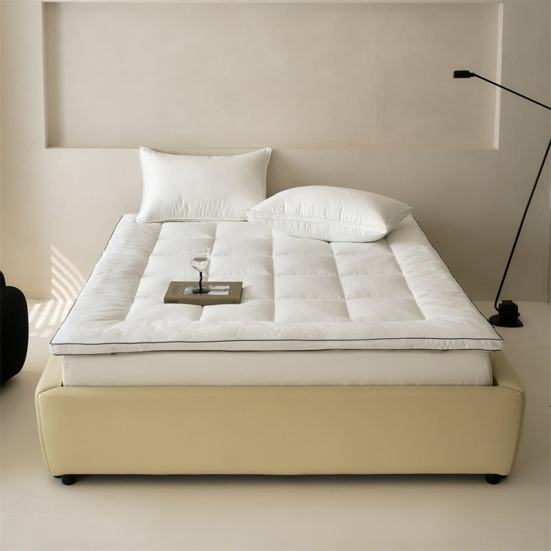 Padded mattress topper made of quilted microfiber and cotton comfort