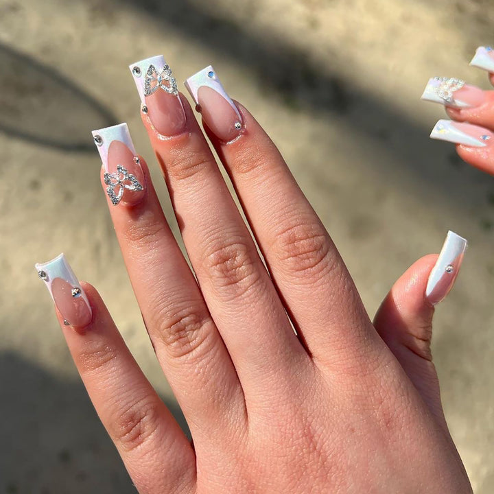 Elegant Nail Art with Glitter and Floral Accents Kalsten