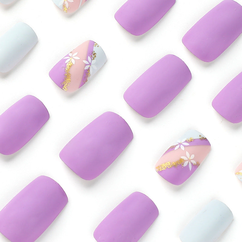 Artistic nail designs with floral motifs and glitter accents Kalsten