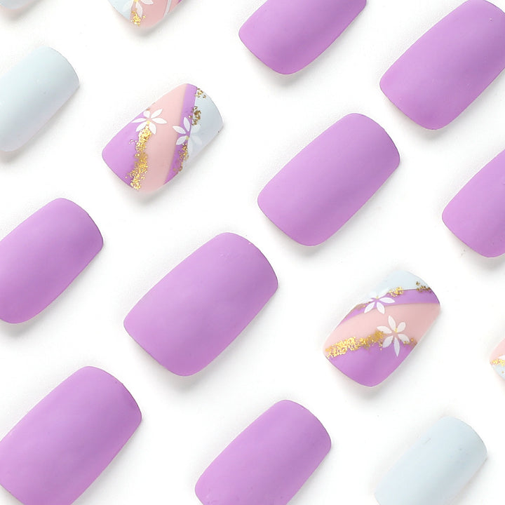 Artistic nail designs with floral motifs and glitter accents Kalsten