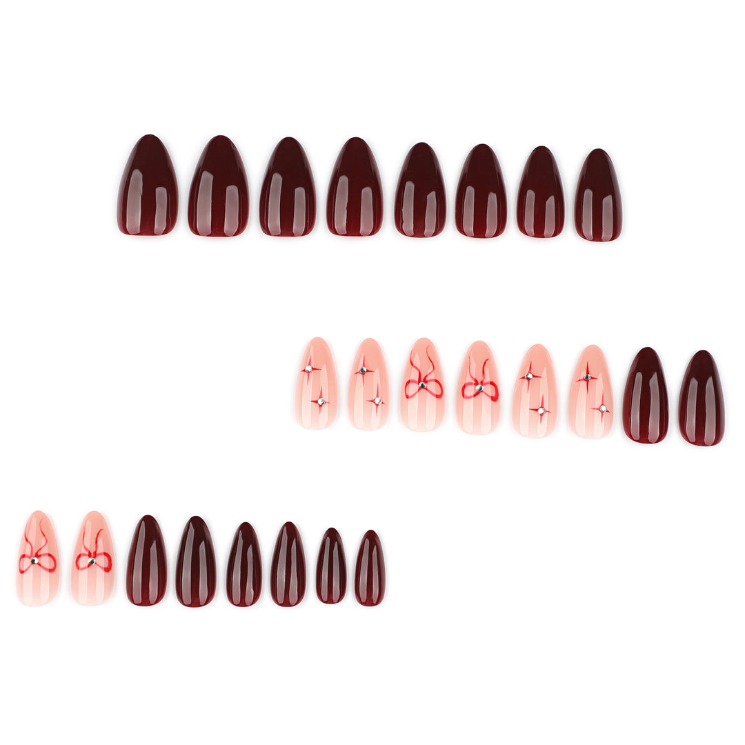 Artful nail art with elegant bows and rhinestone embellishments Kalsten