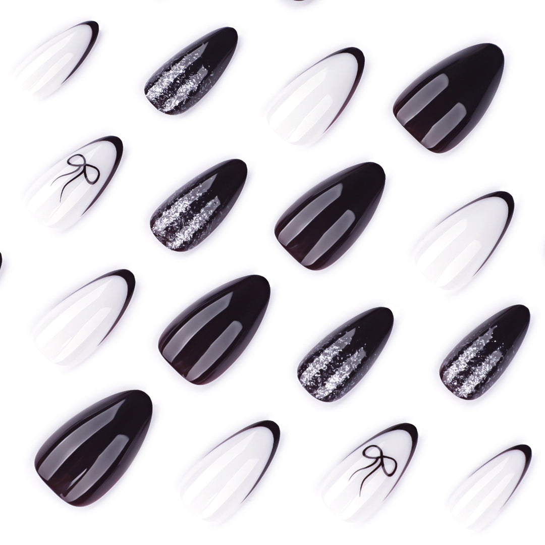 Artful nail art with elegant bow pattern and glitter accents Kalsten