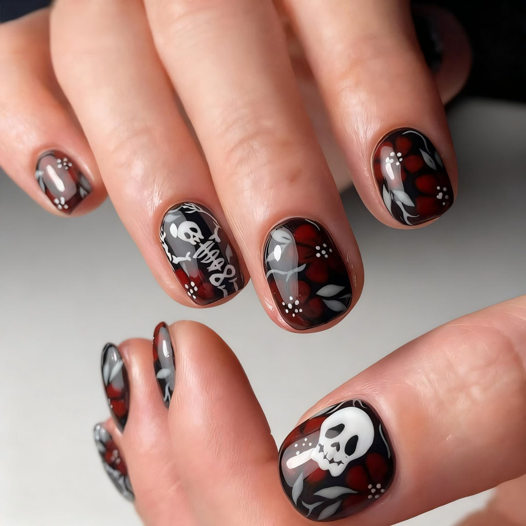 Artificial nail set with creepy skull design and floral accents Kalsten