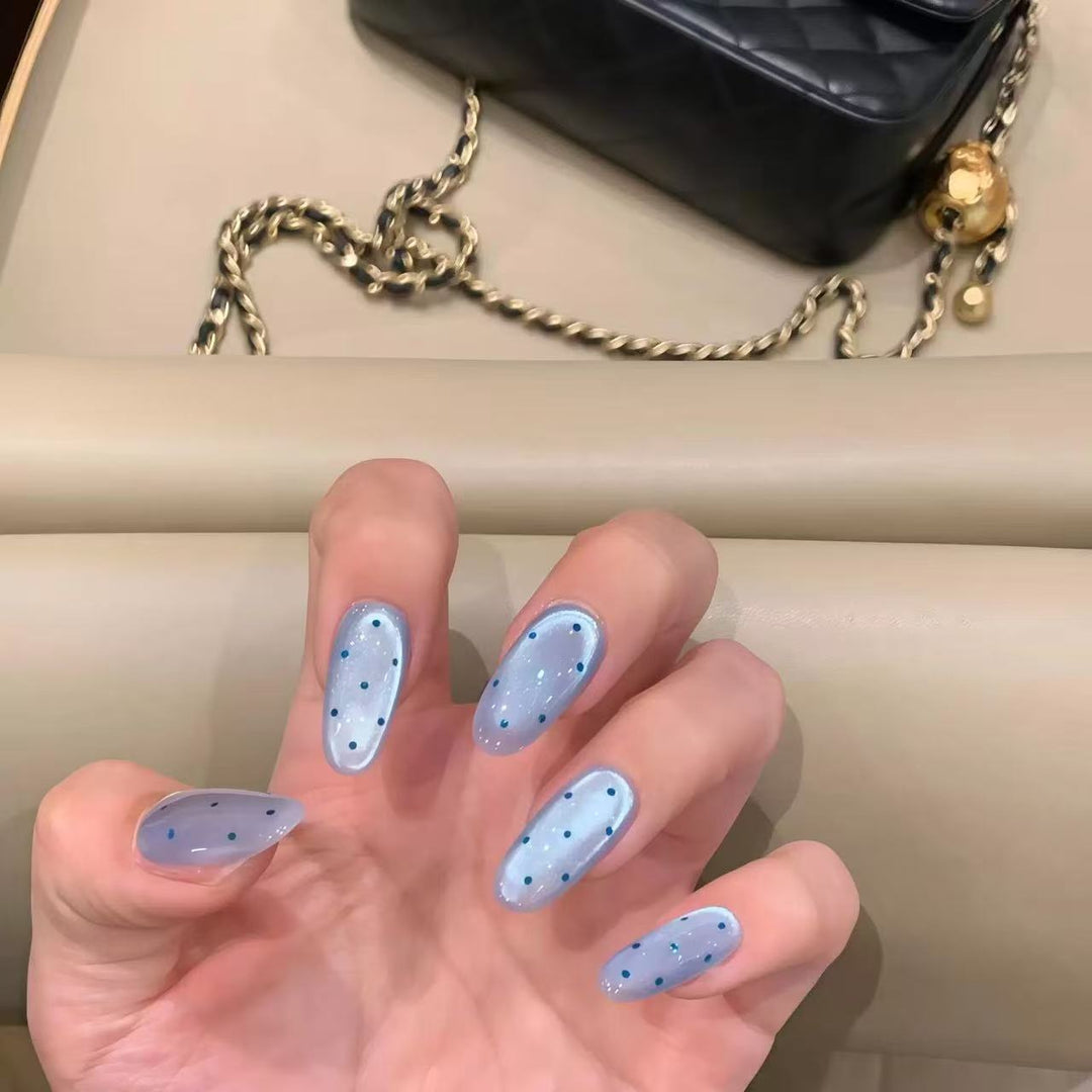 Elegant Stiletto Nail Extensions with Decorative Accents