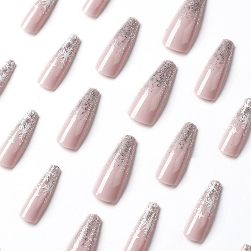 Artful nail art in winter design with glitter and snowflakes Kalsten