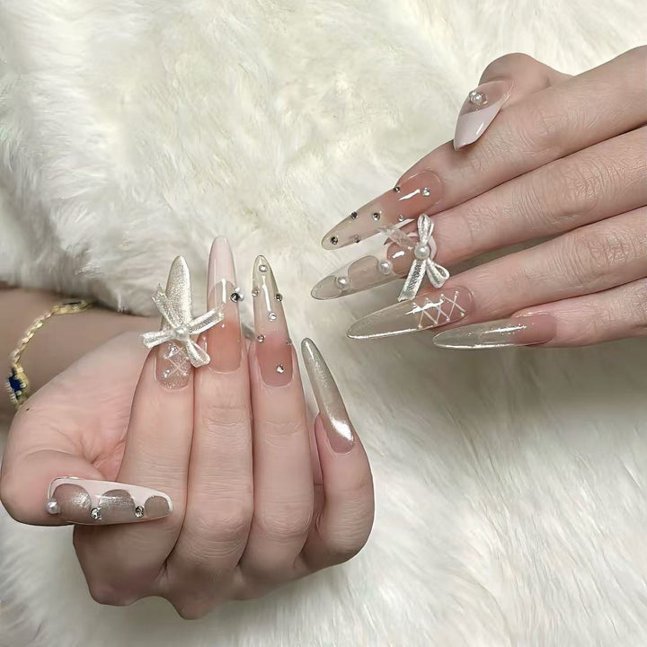 Elegant Stiletto Nail Art Extensions with Decorative Accents