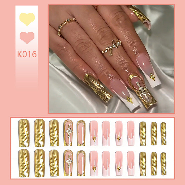 Acrylic nail set with elegant golden embellishments and glamorous accents Kalsten