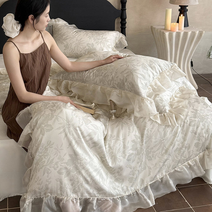 Elegant bedding set made of fine satin jacquard with delicate floral relief and decorative ruffle