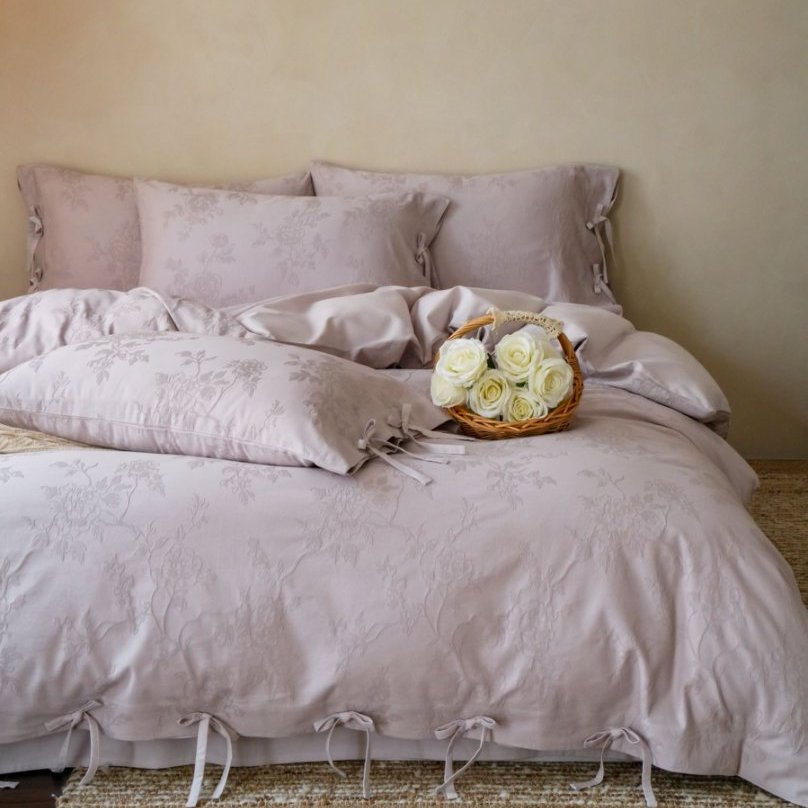 Fine cotton bedding set with jacquard floral pattern and side decorative ribbons