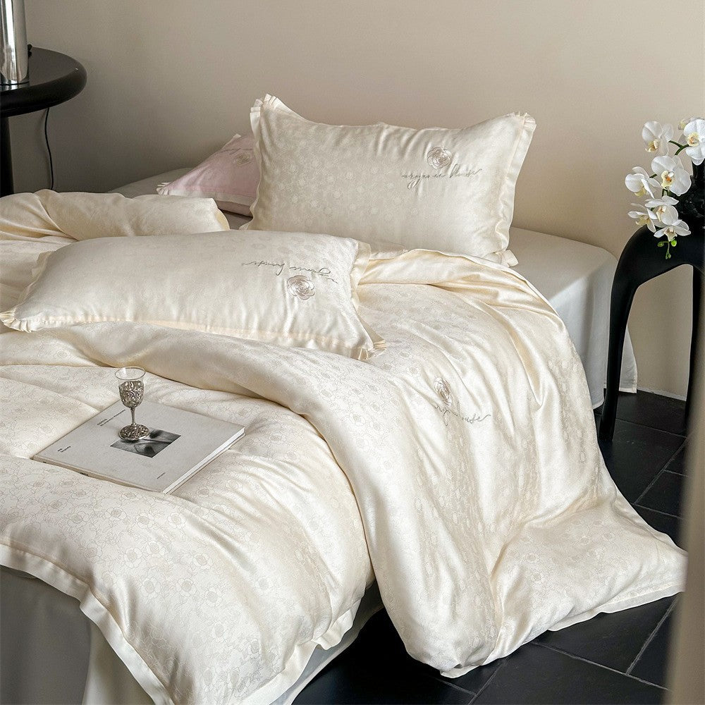 Luxurious cotton satin bedding set with jacquard relief and embroidered rose motif