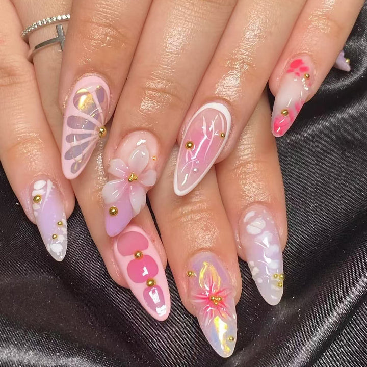 Artful Nail Extensions with Floral Patterns and Rhinestone Embellishments Kalsten