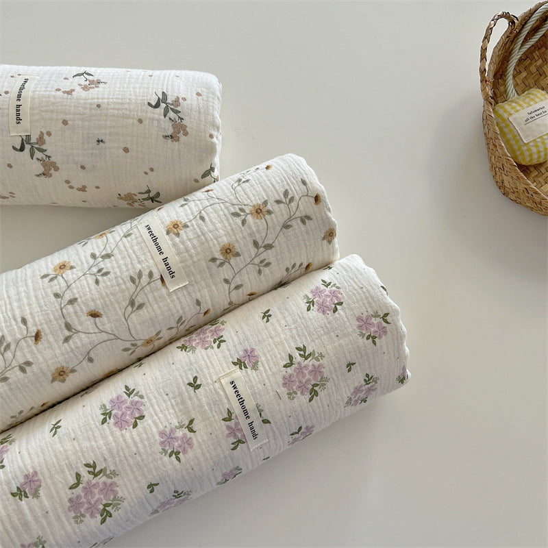 Unisex versatile muslin blanket with floral accents Kalsten