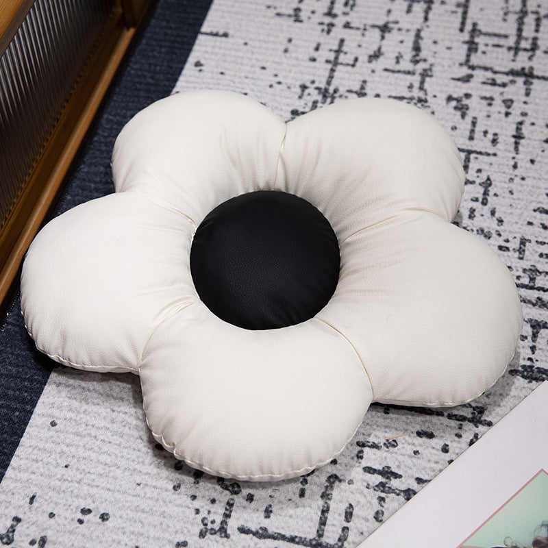 Padded seat cushion in flower shape with faux leather center piece and fluffy edge padding