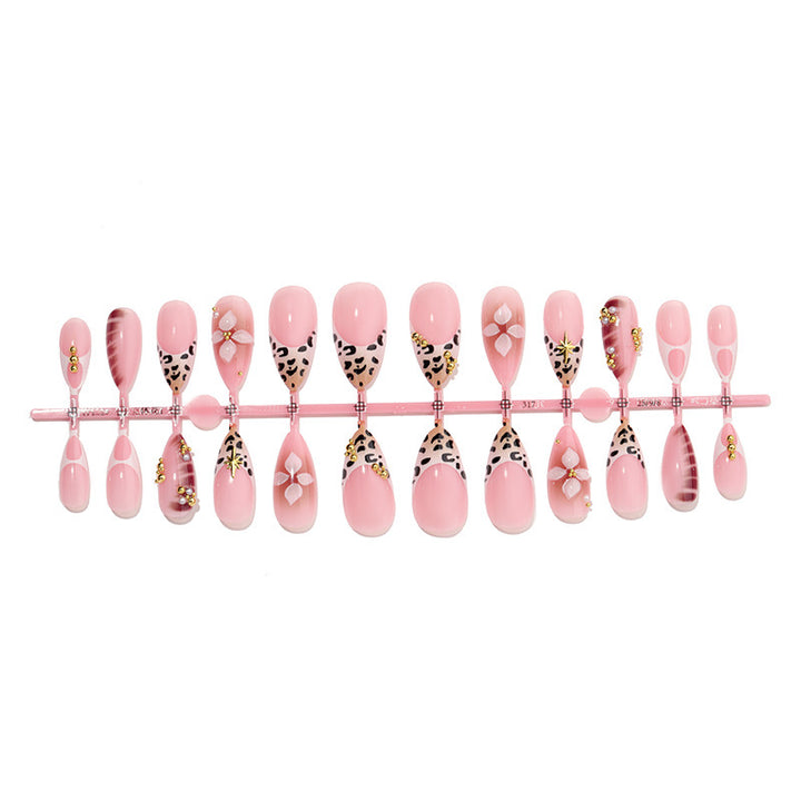 Acrylic nail set with glamorous accents and floral decorations Kalsten