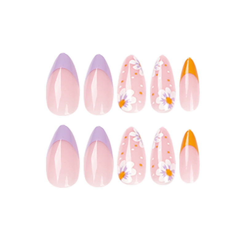 Artful nail art with floral accents and gradient colors Kalsten
