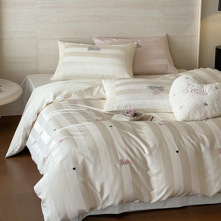 Luxurious cotton percale bedding set with fine striped jacquard look and embroidered lettering