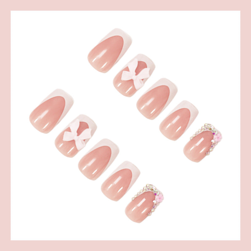 Artificial nail set with elegant bow and glitter designs Kalsten