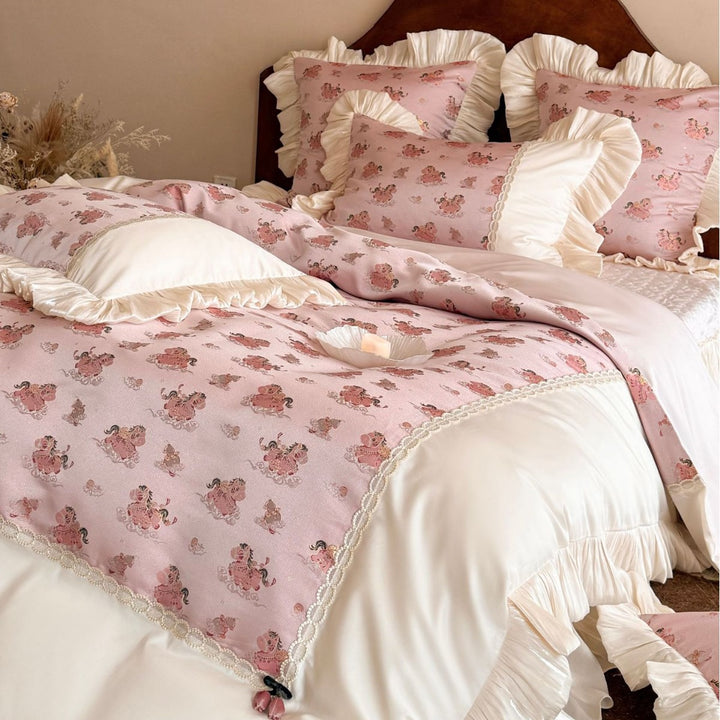 Romantic bed linen set with ruffles, lace border, and vintage print