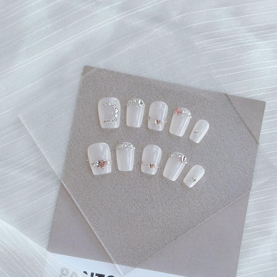 Artistic Press-On Nail Art Set with Heart and Celestial Designs