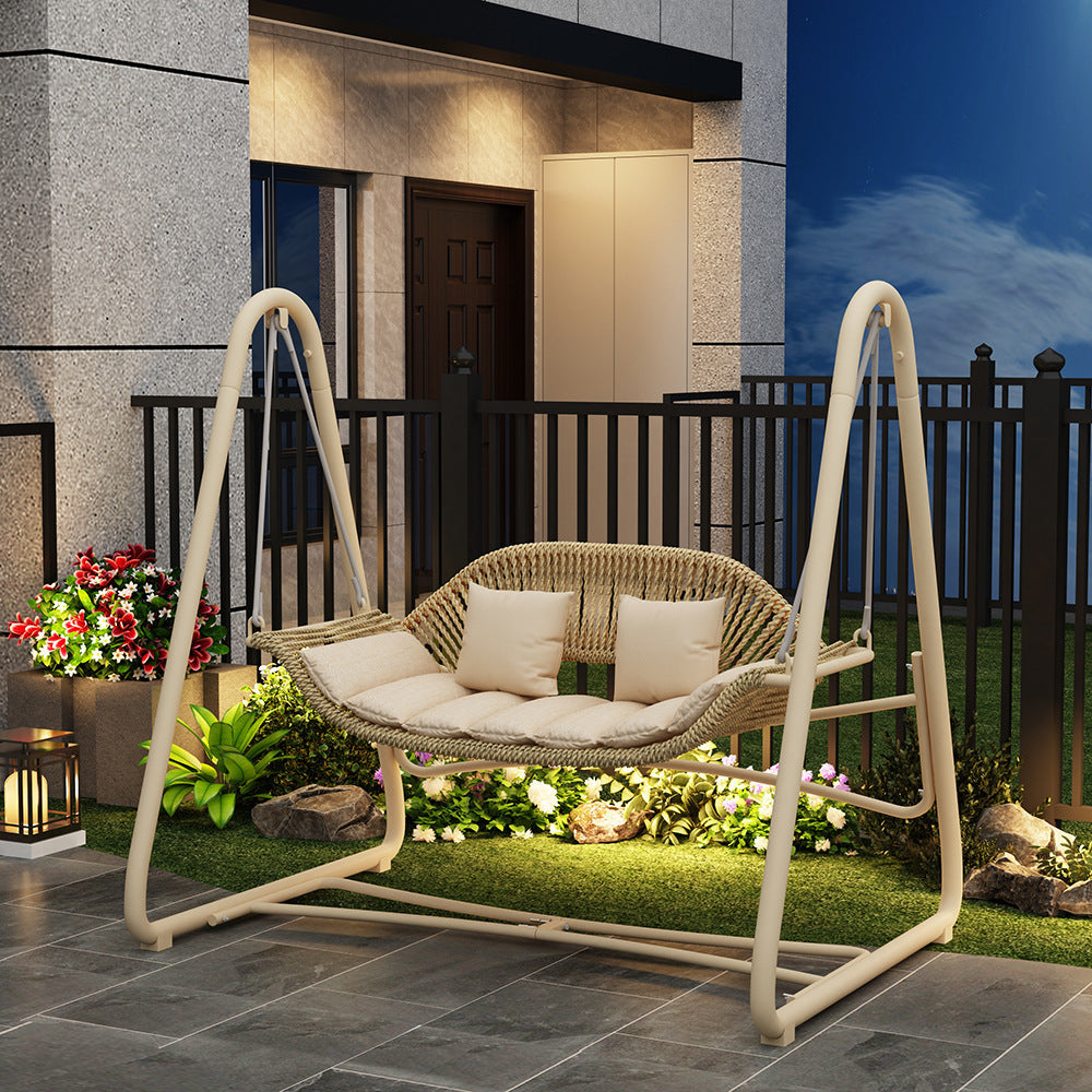 Woven rattan outdoor swing loveseat with padded cushions and powder-coated steel frame Kalsten
