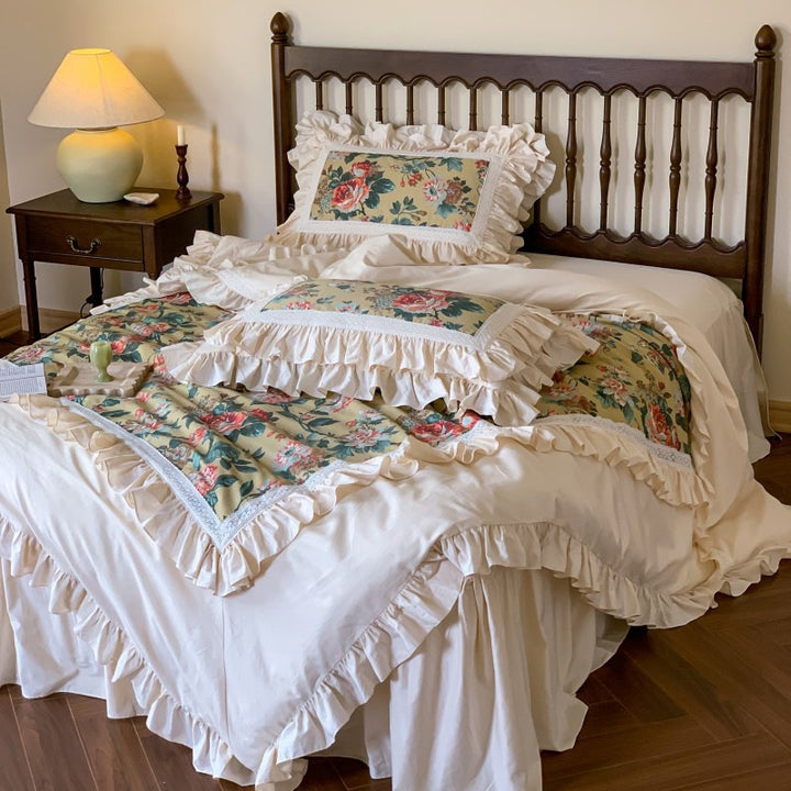 Romantic bedding set with ruffles, floral inserts and decorative pillowcase